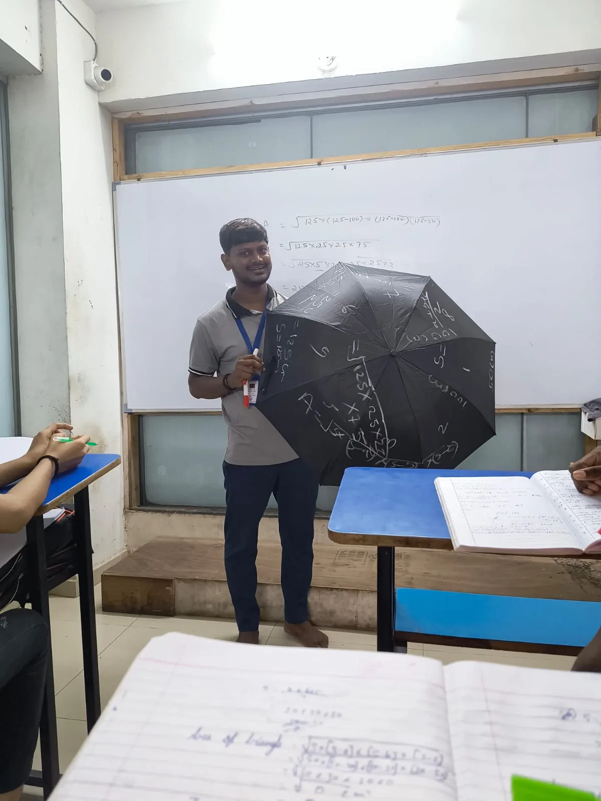Teacher guiding students in a bright classroom